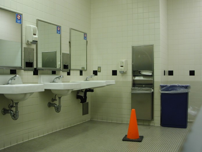 Orange cone in a commercial bathroom. Image courtesy of http://www.unprofound.com/